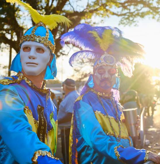 Two men in Mardi Gras costumes