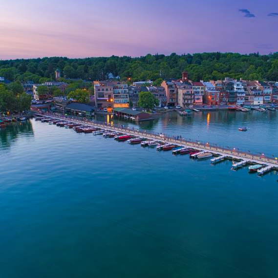 Overhead photo of town of Skaneateles, Skaneateles Lake and the Pier at dusk