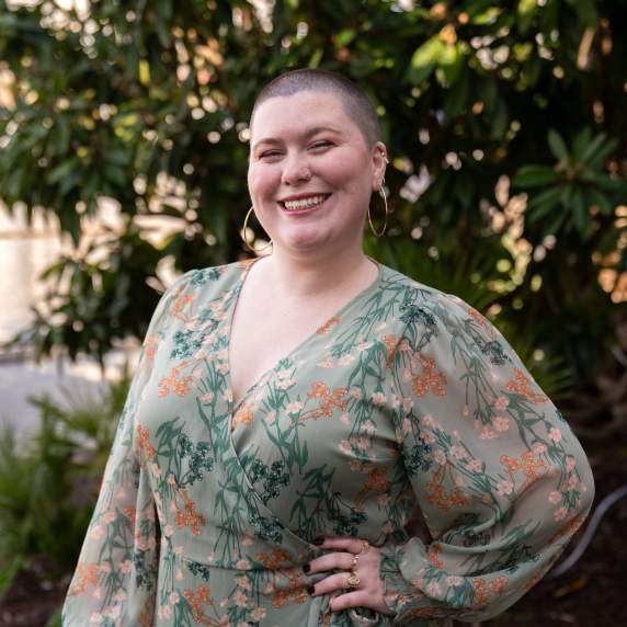 Picture of smiling person with wooded background