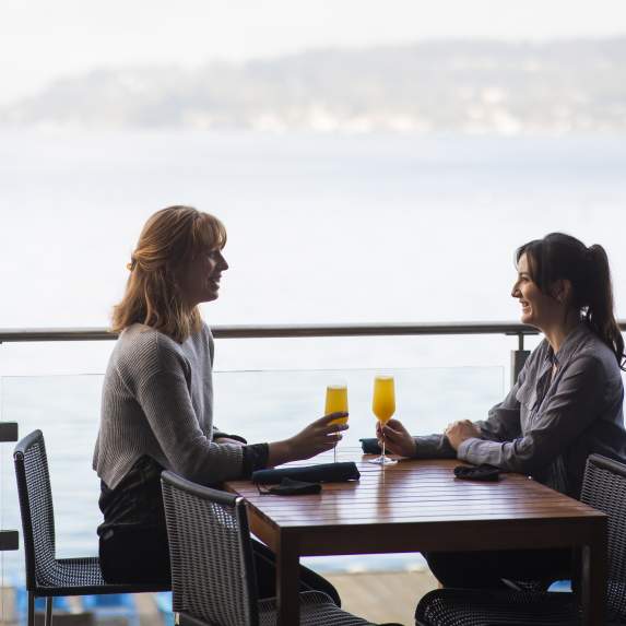 2 women enjoying drinks at Water's Table