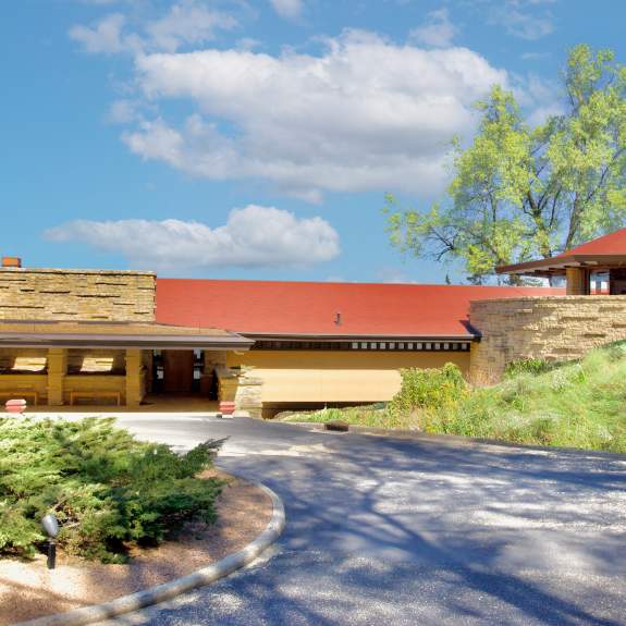 A wide view of Frank Lloyd Wright's home Taliesin, a building with strong geometric shapes and designed in reference to the nature around it.
