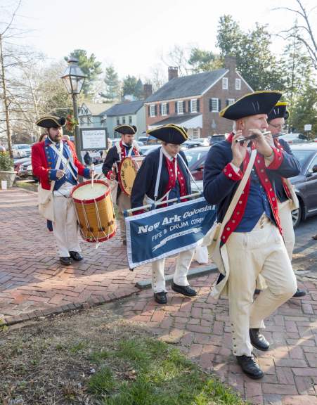 Colonial fife and drum corps in historical uniforms at Odessa holiday event
