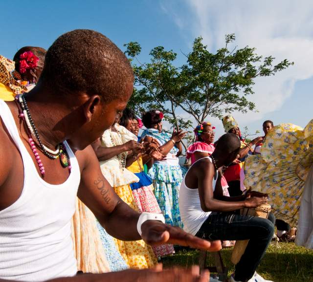 Men playing drums and women performing congo dances  spanish colonial fortress.  Colon province, Panama, Central America.