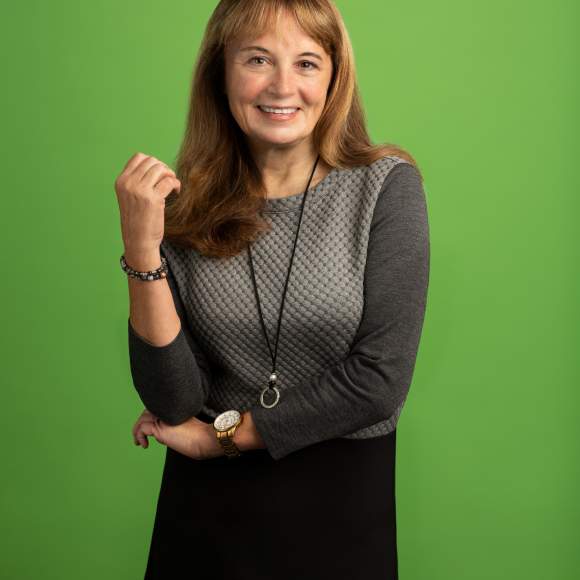 headshot photo with green background