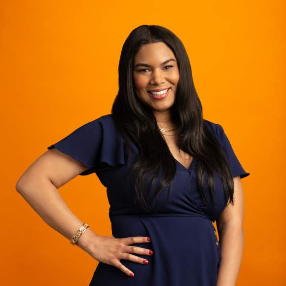 Jenese Wallace headshot on orange background