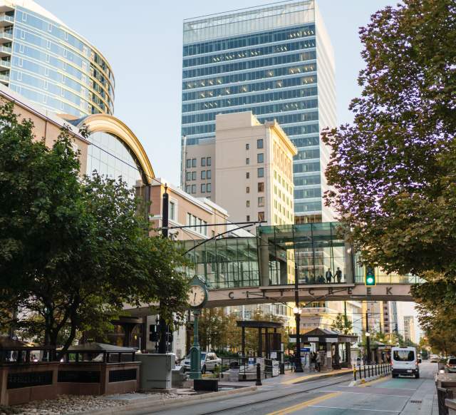 View looking south on main street in Salt Lake in summer time showing the street bridge at City Creek Center