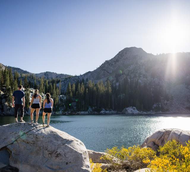 Friends hiking to a lake in Big Cottonwood Canyon
