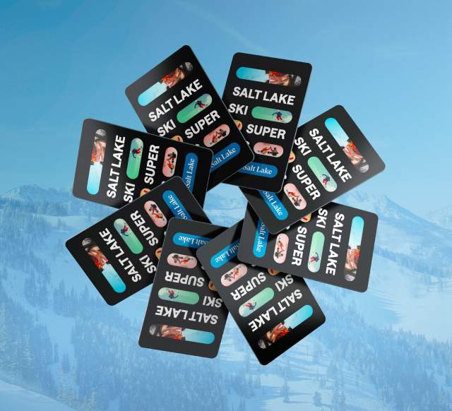8 super pass cards in a circle on top of a faded blue background of mountains with snow