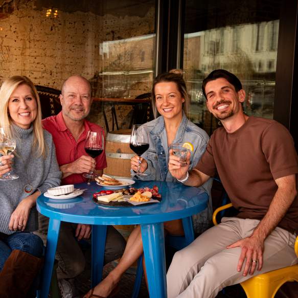 Family celebrating a birthday gathering at Landon Winery in Downtown Denison
