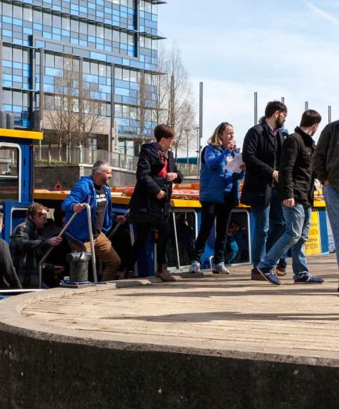 A group of people disembarking a Bristol Ferry Boat at the Temple Quay landing on a Bristol Brewery Tour - credit Bristol Ferry Boats