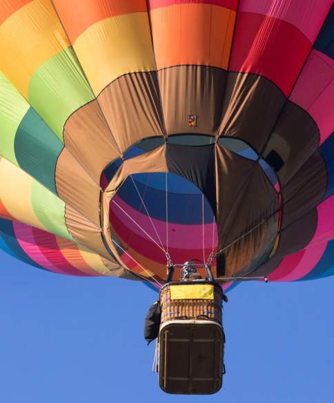A multicoloured balloon in the sky over Bristol