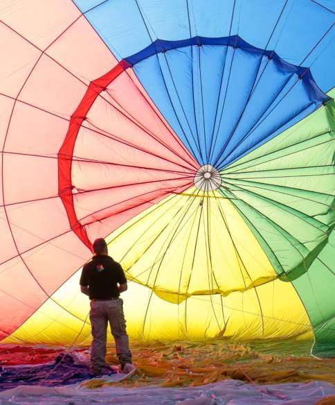 A balloon being inflated by an attendant at Bristol International Balloon Fiesta - credit Paul Box