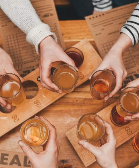 People holding glasses of cider - credit The Stable