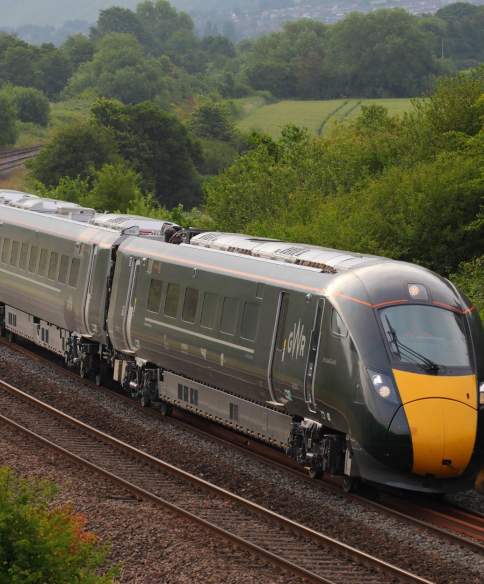 A GWR train travelling at speed on the train track - Credit Great Western Railway