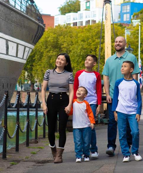 A family exploring the exterior of the SS Great Britain in the Great Western Dockyard, Bristol - credit Brunel's SS Great Britain