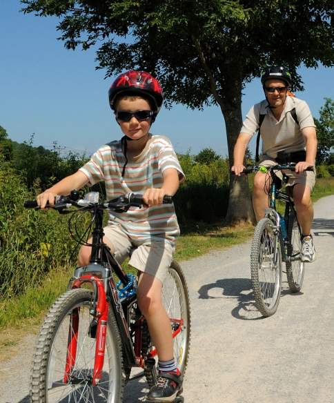 A family cycling on the Strawberry Line path near Bristol - credit Sustrans