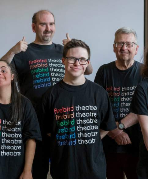 A group of people wearing black t-shirts that say Firebird Theatre Company