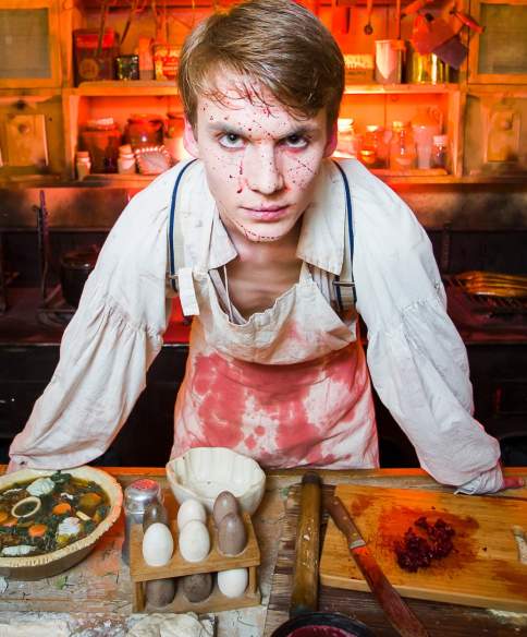 An actor dressed as a butcher covered in fake blood inside Brunel's SS Great Britain, Bristol - credit Adam Gasson