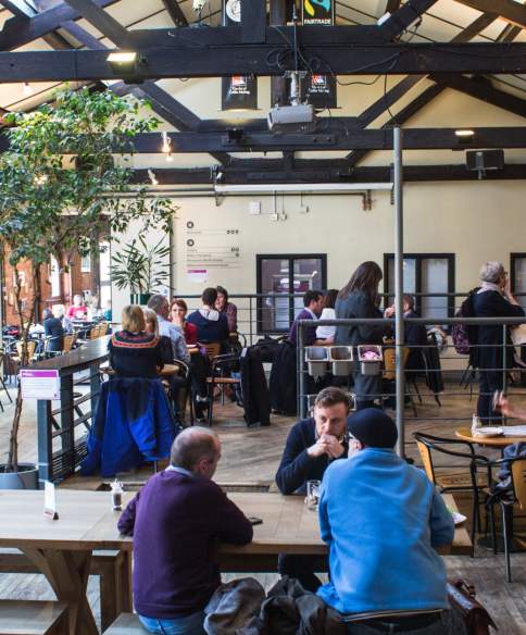 People sat in cafe bar at Watershed on Bristol's Harbourside - credit Watershed