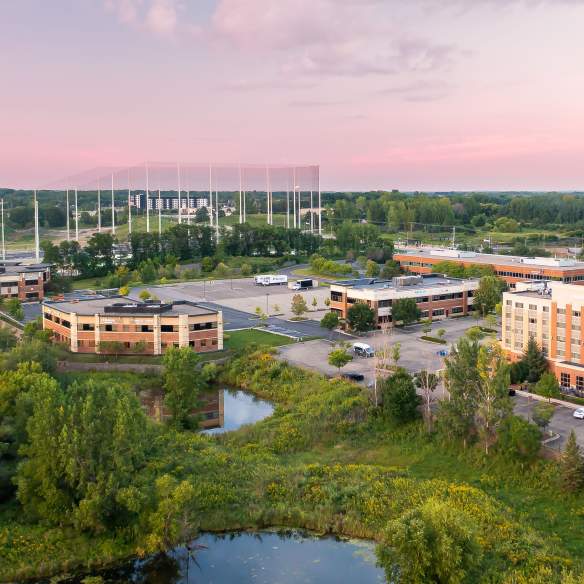 Aerial photo of Topgolf structure and hotels and local businesses in Woodbury.