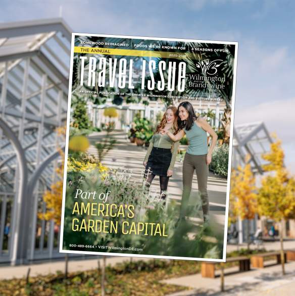2025 Visitor Guide Cover on Blurred Background