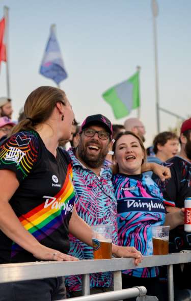 A group of fans celebrate in the stands at a Forward Madison soccer game
