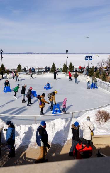 People ice skating on the Edgewater Ice Rink at the Frozen Assets Festival