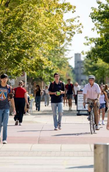 Students walking and biking on UW-Madison campus