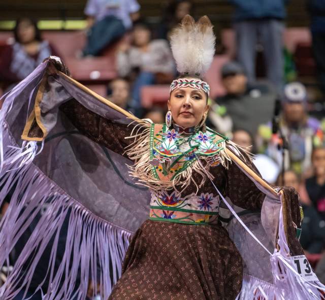 women's fancy shall dancer at the black hills powwow in rapid city, sd