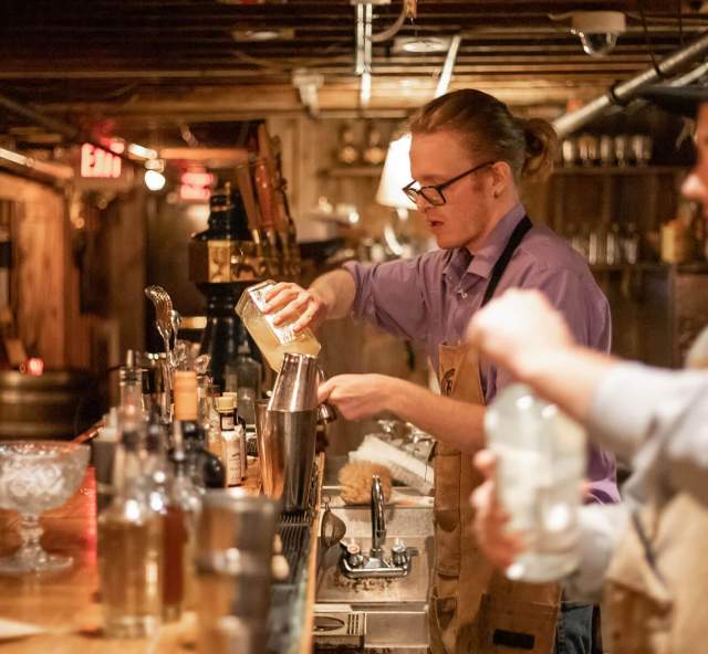 bartendars creating drinks in the prohibition style speakeasy found in rapid city