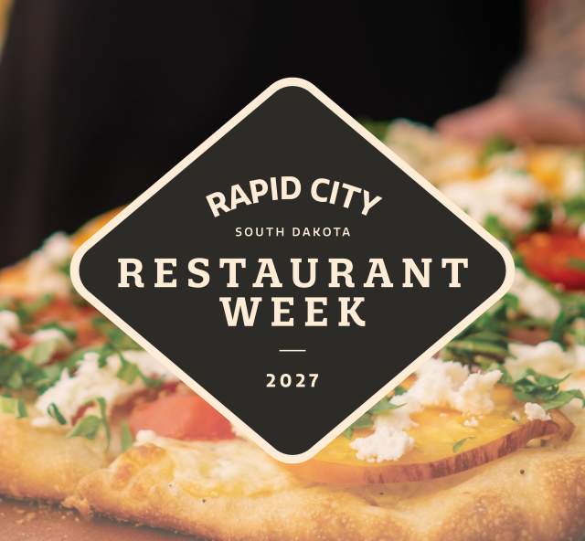 The logo of Restaurant Week 2027 superimposed over a closeup image of a waiter carrying a flatbread pizza.