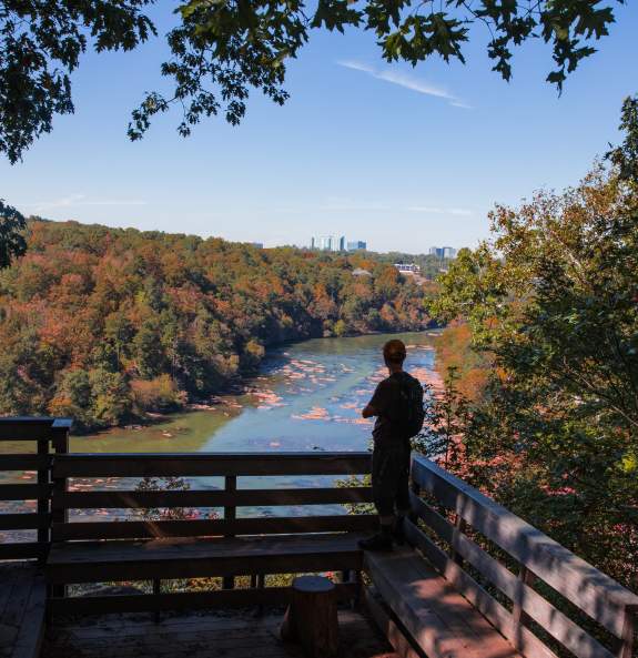 View of person looking out over the Chattahoochee River at Poppi's Point on the East Palisades