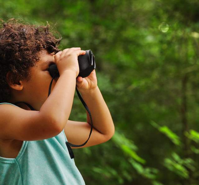 Boy - binoculars side view