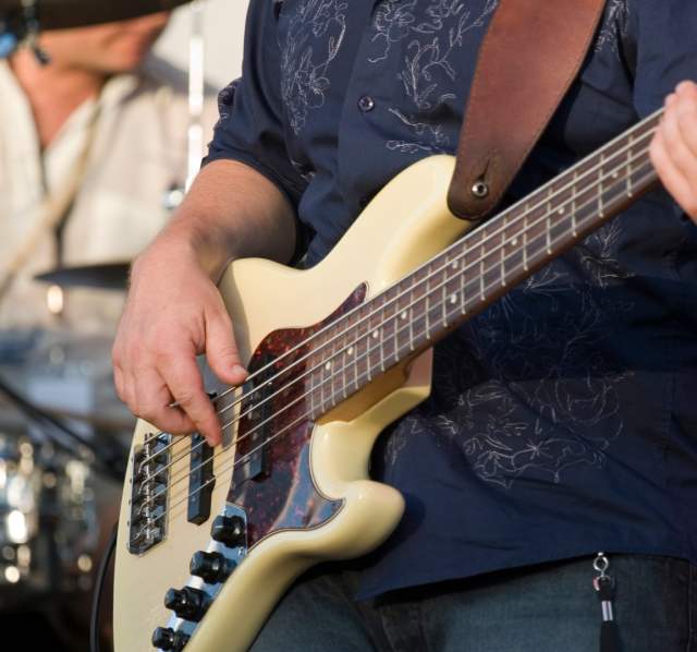 Guitarist and drummer performing