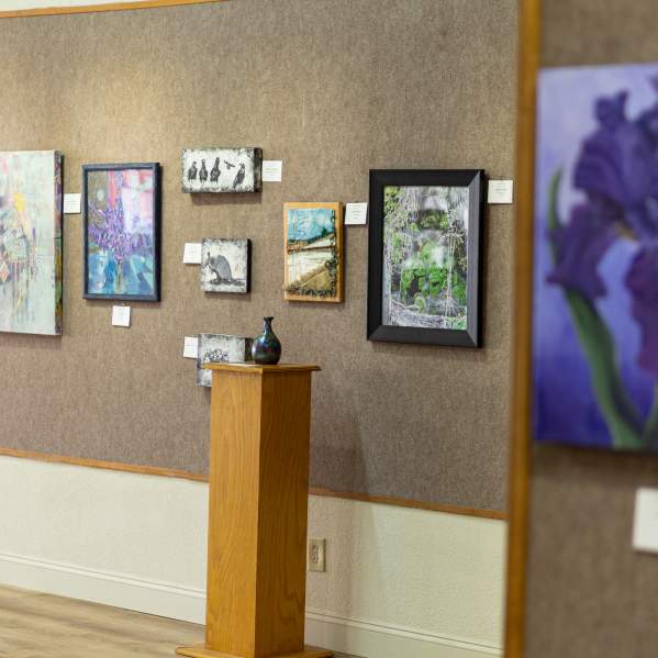Photo of gallery of paintings inside of the Brownwood Art Center Downtown.