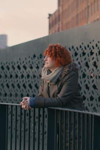 Corin Bell looking at Manchester canal in the distance.
