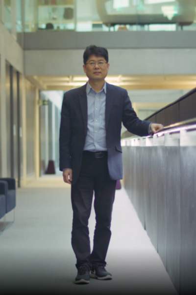 Dr. Timothy Jung stood in a corridor in Manchester's Creative AR & VR Hub