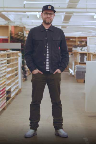 John Owens, Joint Artistic Director at Design Manchester stood in a corridor