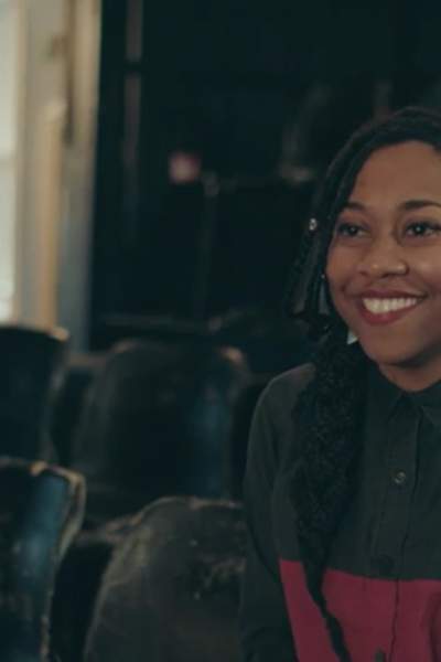 Poet Keisha Thompson in an auditorium