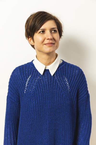 Dr Maria against a white backdrop