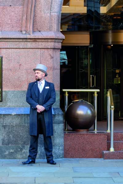 Doorman outside of The Midland hotel in Manchester.