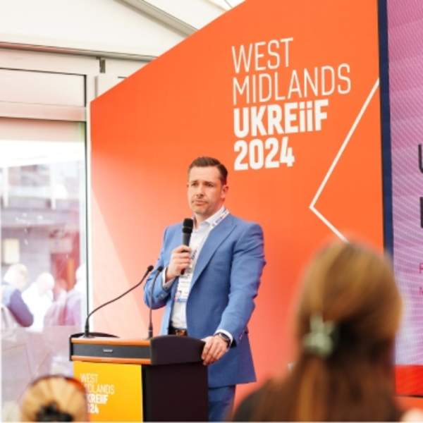 James Dickens presents at the West Midlands Pavilion during UKREiiF 2024