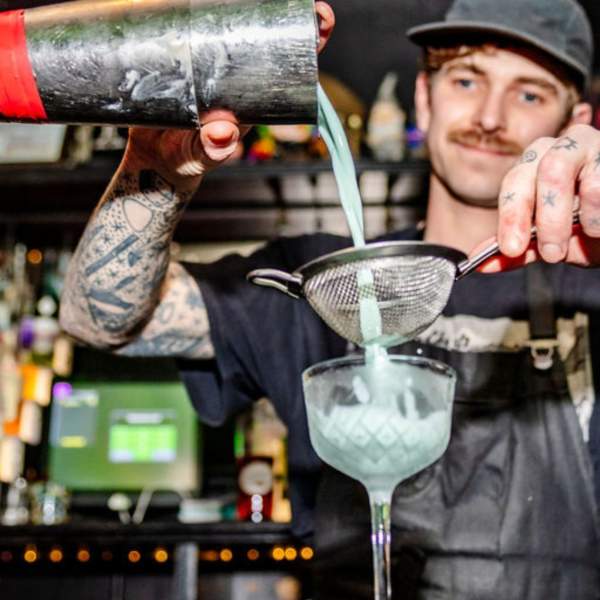 Barman pouring cocktail - Bristol City Centre BID