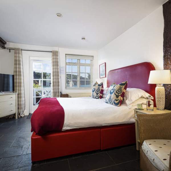hotel room with a bed and an armchair