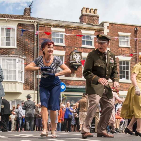 Dancers dressed in vintage clothing performing at the Bridlington 1940s and 50s Festival in East Yorkshire