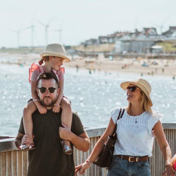 A family walk along the sea front in Bridlington, East Yorkshire