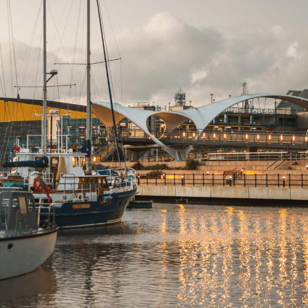 Hull Marina lit up on an evening with Murdoch's Bridge in the background.