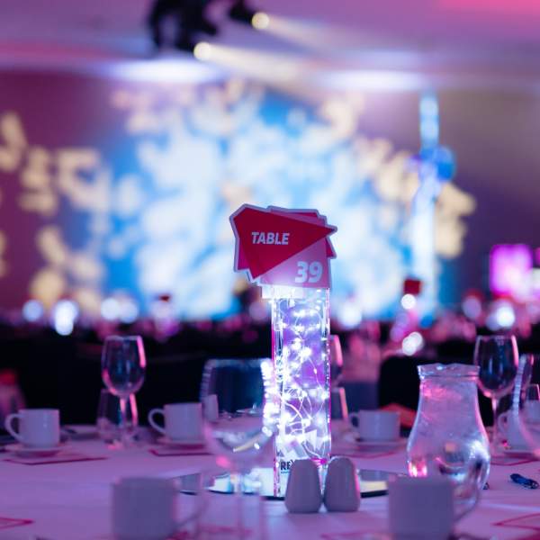 A view of the table decorations and stage at the REYTAs 2023