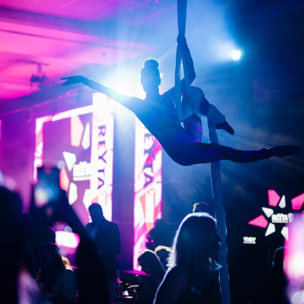 An aerialist performing at the 2023 REYTAs
