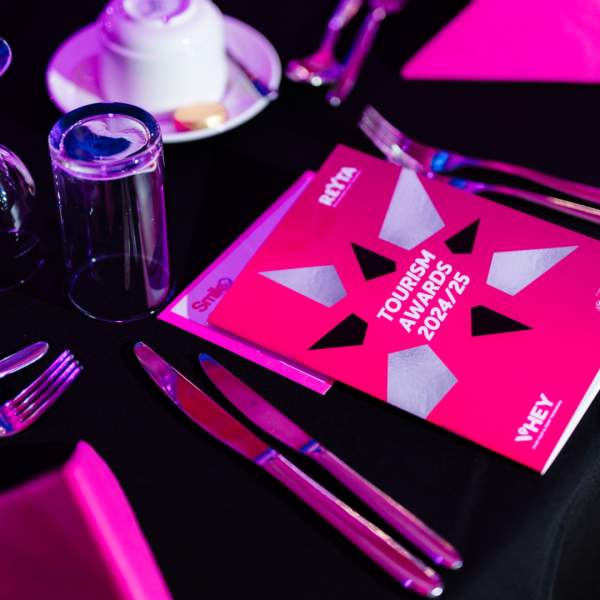 A table setting at the REYTAs including cutlery, drinkware and REYTAs 2024/25 programme